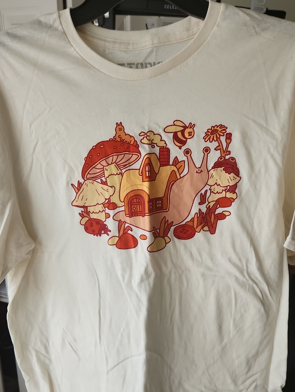 Hot Topic Cream Snail Cottage Art Print with Red and Orange Accents